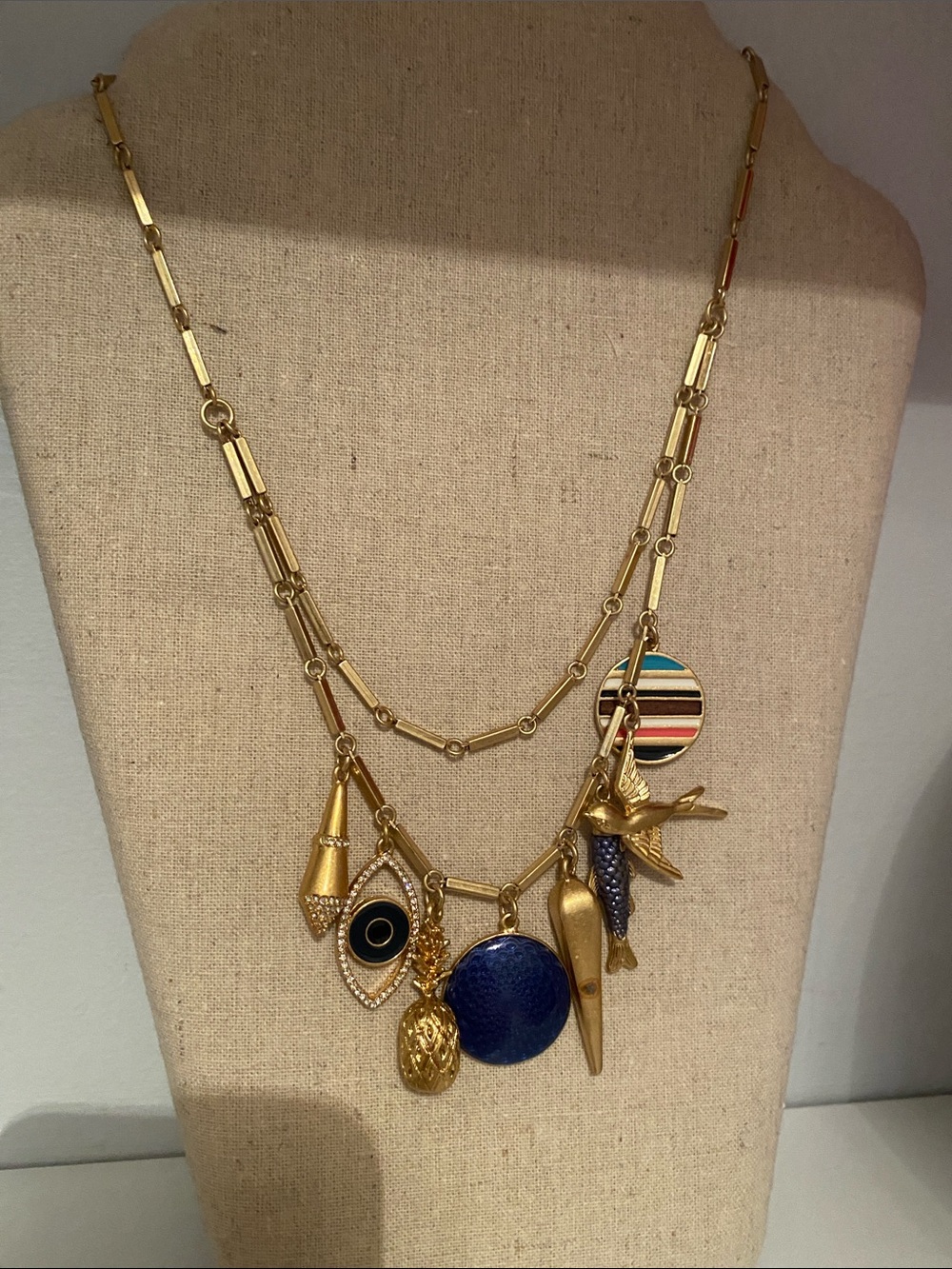 Stella & Dot Gold Multi-Charm Necklace with Blue and Black Accents